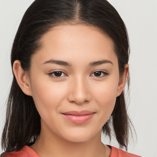 Joyful white young-adult female with long  brown hair and brown eyes