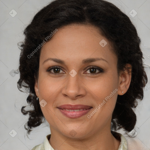 Joyful latino adult female with medium  brown hair and brown eyes