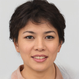 Joyful asian young-adult female with short  brown hair and brown eyes