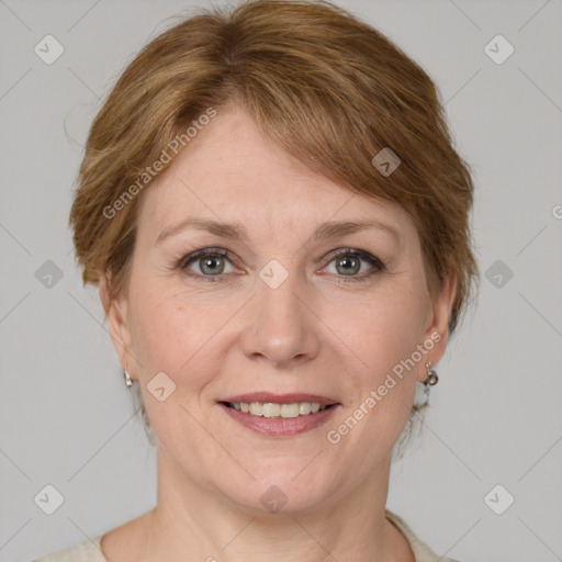 Joyful white adult female with medium  brown hair and grey eyes