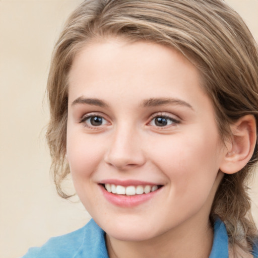 Joyful white young-adult female with medium  brown hair and blue eyes