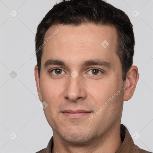 Joyful white young-adult male with short  brown hair and brown eyes