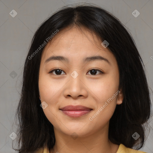 Joyful asian young-adult female with long  brown hair and brown eyes