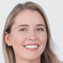 Joyful white young-adult female with long  brown hair and blue eyes