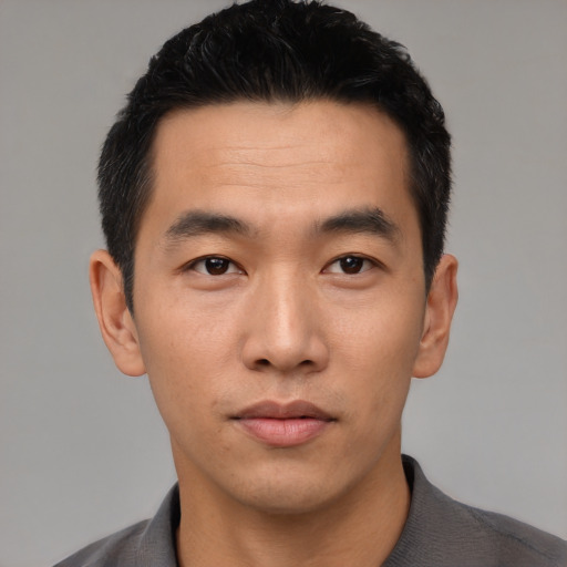 Neutral asian young-adult male with short  black hair and brown eyes