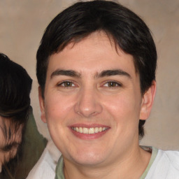 Joyful white young-adult male with medium  brown hair and brown eyes