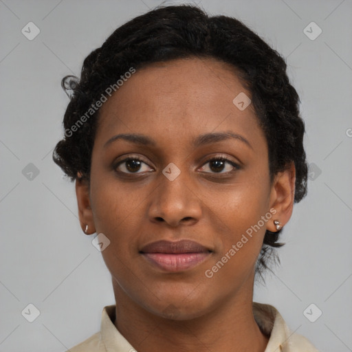 Joyful black young-adult female with short  black hair and brown eyes