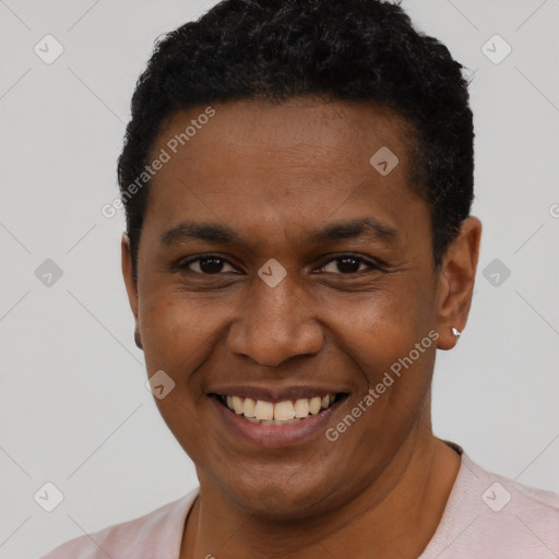 Joyful black young-adult male with short  black hair and brown eyes