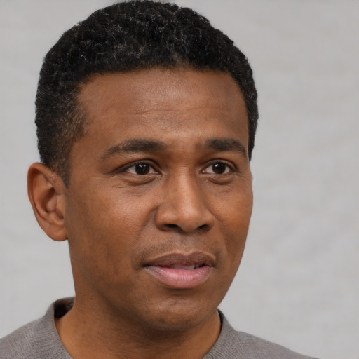 Neutral black adult male with short  black hair and brown eyes