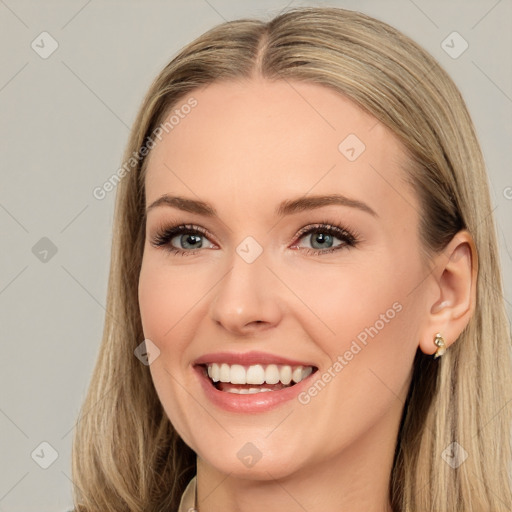 Joyful white young-adult female with long  brown hair and brown eyes