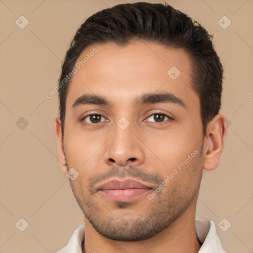 Joyful white young-adult male with short  brown hair and brown eyes