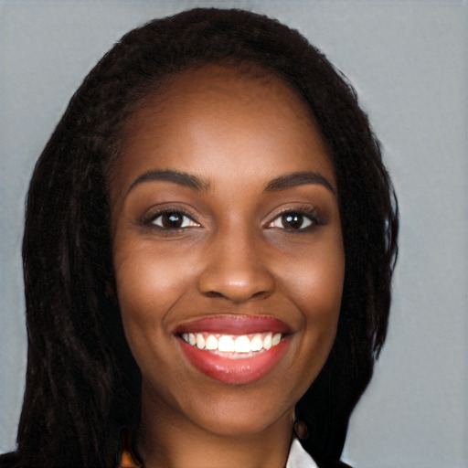 Joyful black young-adult female with long  black hair and brown eyes