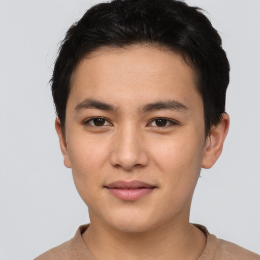 Joyful asian young-adult male with short  brown hair and brown eyes