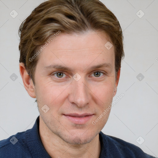 Joyful white adult male with short  brown hair and grey eyes