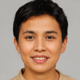 Joyful asian young-adult male with short  black hair and brown eyes