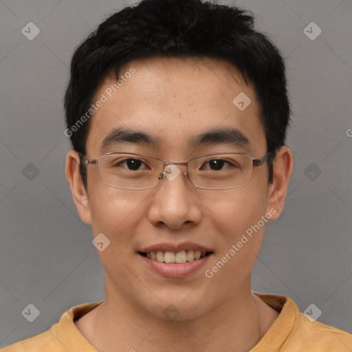 Joyful asian young-adult male with short  brown hair and brown eyes