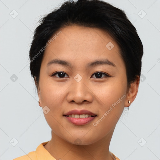 Joyful asian young-adult female with short  brown hair and brown eyes
