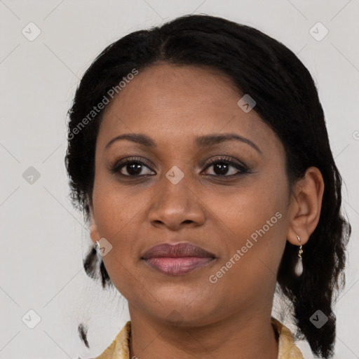 Joyful black adult female with medium  brown hair and brown eyes
