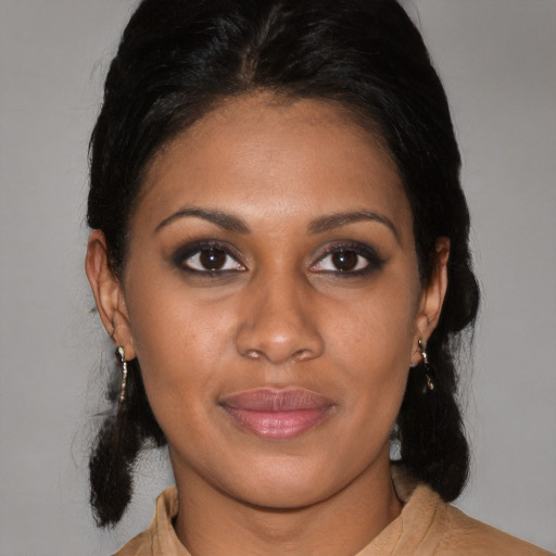 Joyful black young-adult female with medium  black hair and brown eyes