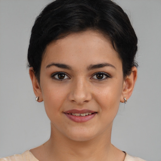 Joyful latino young-adult female with short  brown hair and brown eyes