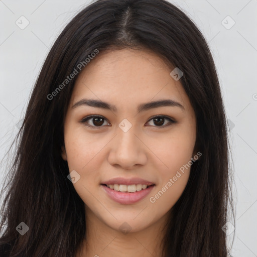 Joyful latino young-adult female with long  brown hair and brown eyes