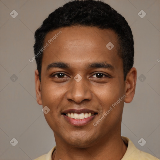 Joyful black young-adult male with short  black hair and brown eyes