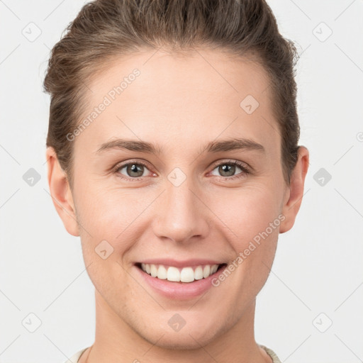 Joyful white young-adult female with short  brown hair and grey eyes