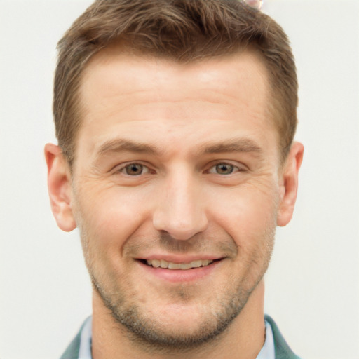 Joyful white young-adult male with short  brown hair and grey eyes