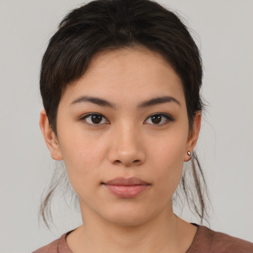 Neutral white young-adult female with short  brown hair and brown eyes