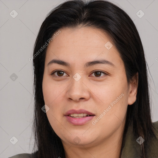 Joyful asian young-adult female with long  brown hair and brown eyes