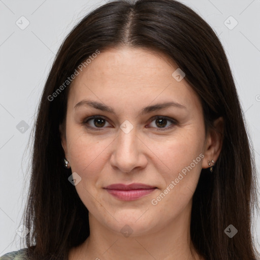 Joyful white adult female with long  brown hair and brown eyes