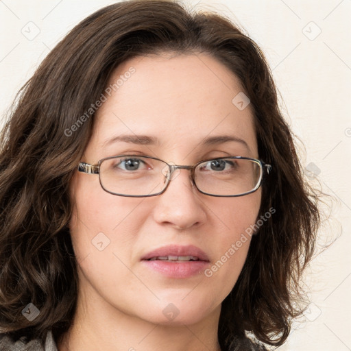 Joyful white young-adult female with long  brown hair and blue eyes