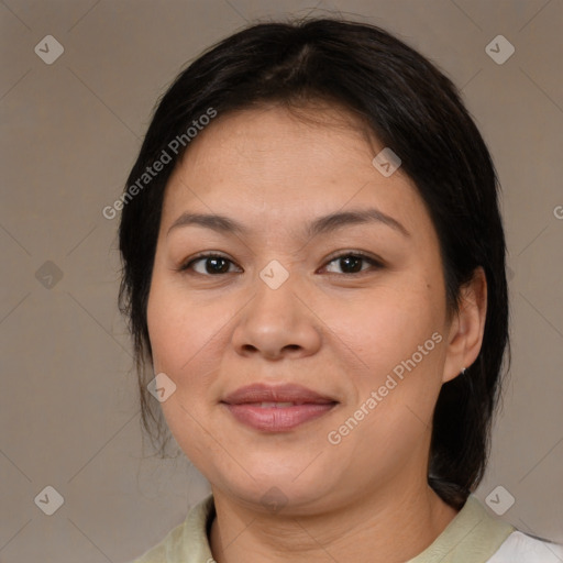 Joyful asian adult female with medium  brown hair and brown eyes