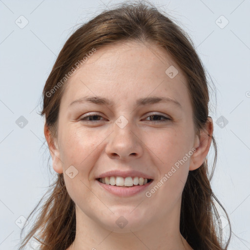 Joyful white young-adult female with long  brown hair and grey eyes