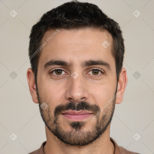 Joyful white young-adult male with short  black hair and brown eyes