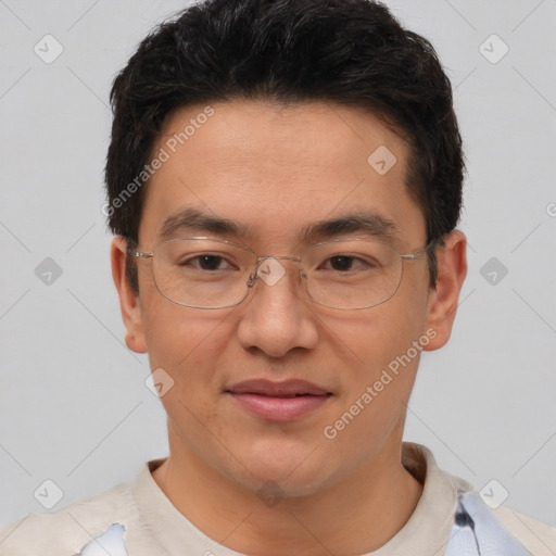 Joyful asian adult male with short  brown hair and brown eyes