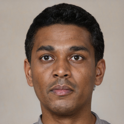 Neutral black young-adult male with short  black hair and brown eyes