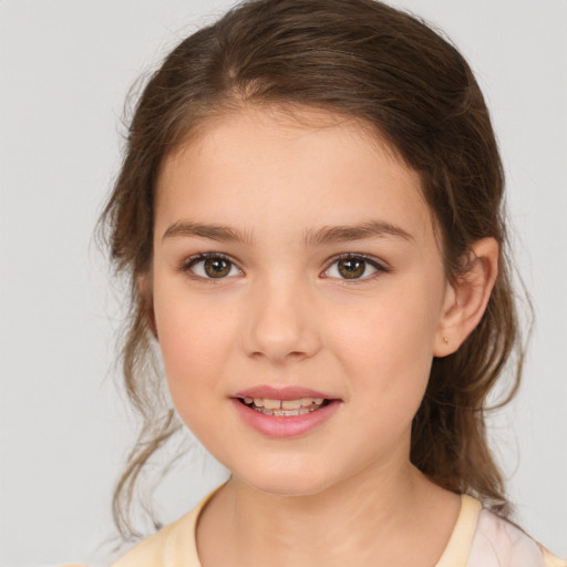 Joyful white child female with medium  brown hair and brown eyes