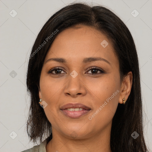 Joyful latino young-adult female with long  brown hair and brown eyes