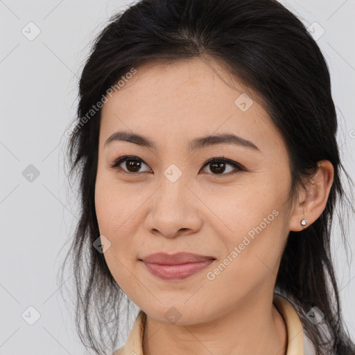 Joyful asian young-adult female with long  brown hair and brown eyes