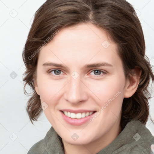 Joyful white young-adult female with medium  brown hair and blue eyes