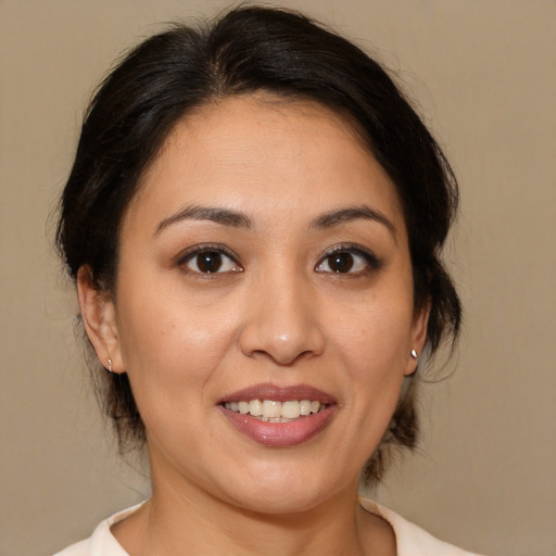 Joyful white young-adult female with medium  brown hair and brown eyes