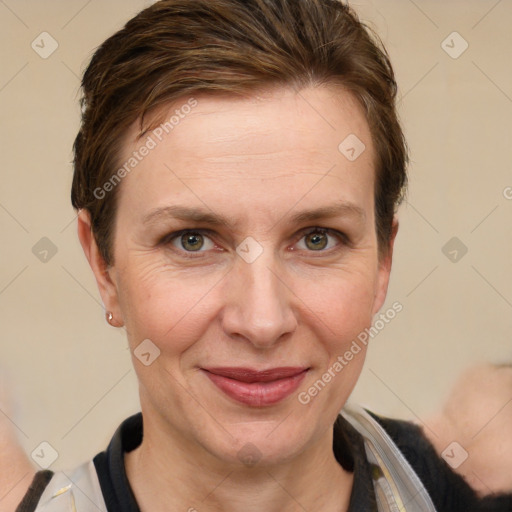 Joyful white adult female with short  brown hair and grey eyes