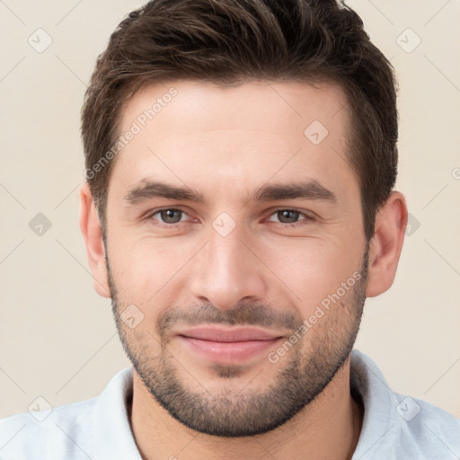 Joyful white young-adult male with short  brown hair and brown eyes