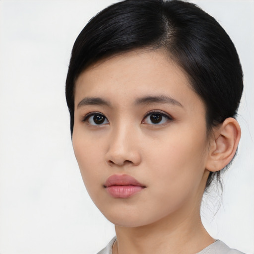 Neutral asian young-adult female with medium  black hair and brown eyes