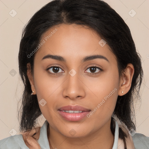 Joyful latino young-adult female with medium  brown hair and brown eyes