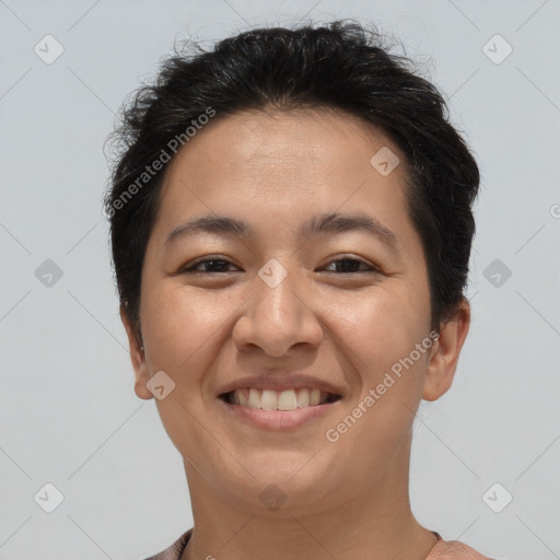 Joyful asian young-adult female with short  brown hair and brown eyes