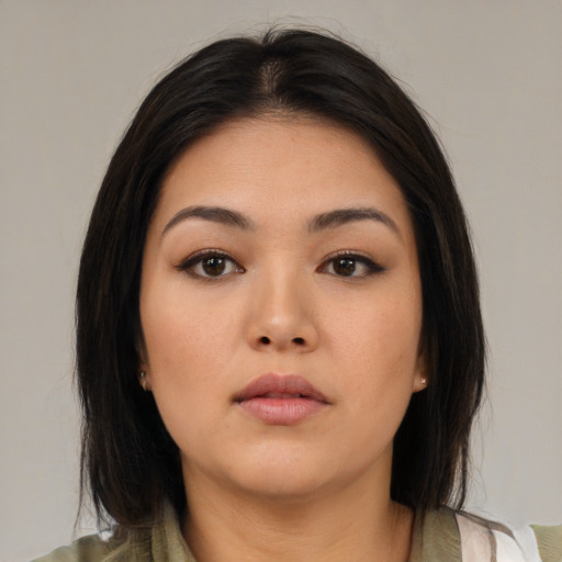 Neutral asian young-adult female with medium  brown hair and brown eyes