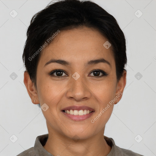 Joyful latino young-adult female with short  black hair and brown eyes