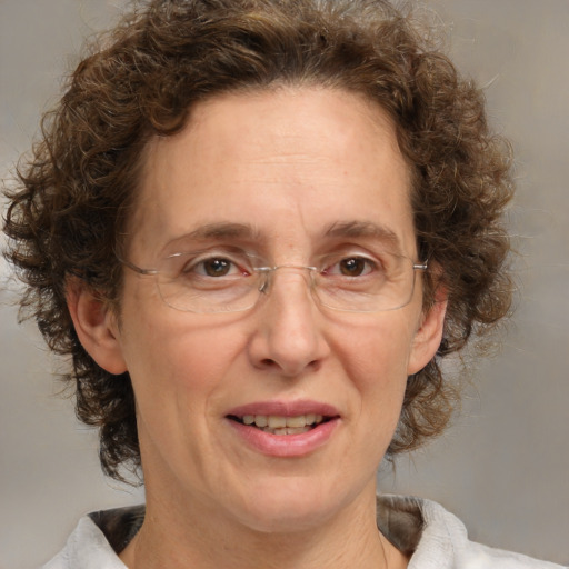 Joyful white middle-aged female with medium  brown hair and brown eyes